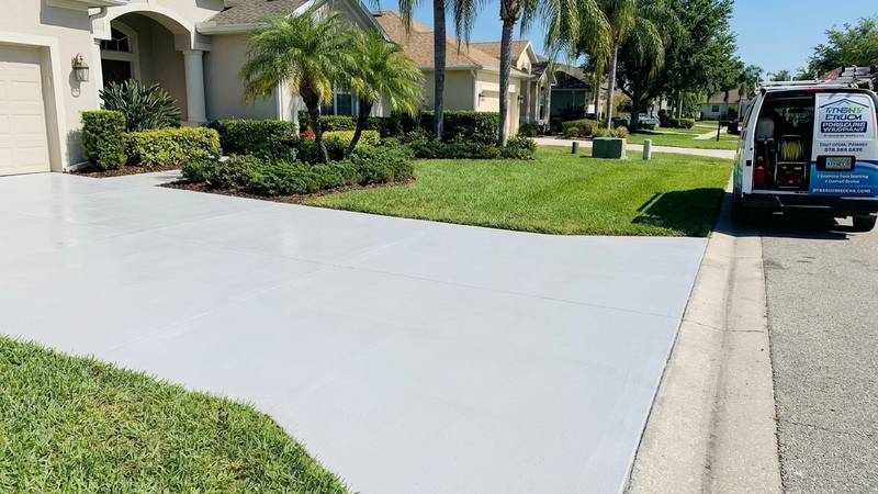 Example of driveway pressure washing in Palm Harbor, FL — after soft washing. Paver driveway - stain lift + curb + sidewalk included.