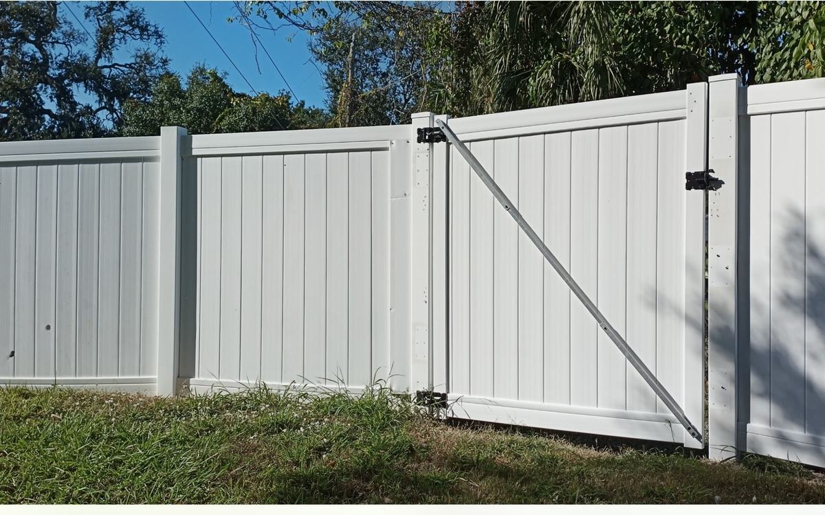 A fence run soft washed back to bright by Sandbar — real job photo