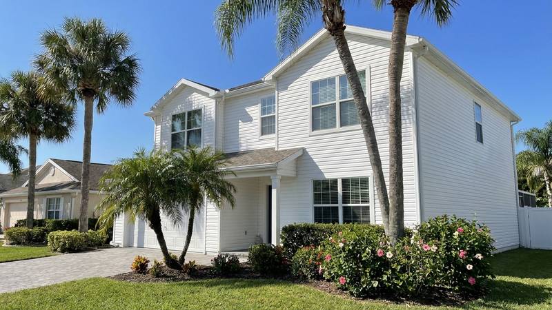 Example of house washing in Clearwater, FL — after soft washing. 2-story stucco - coastal salt + mildew protocol, beachside property.