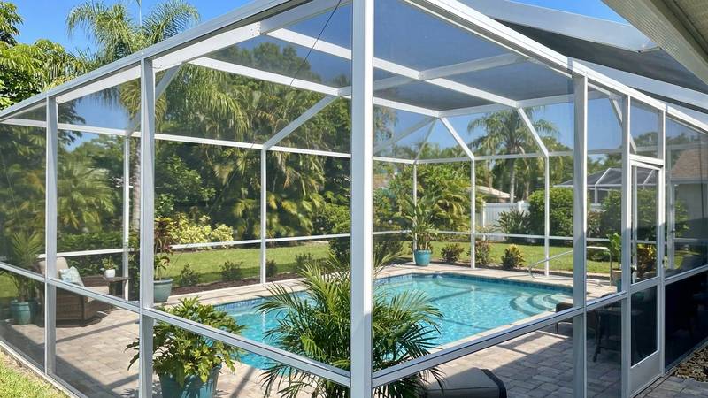 Example of pool cage cleaning in Safety Harbor, FL — after soft washing. Lanai screen + frame restore. Lovebug residue + mildew removed.