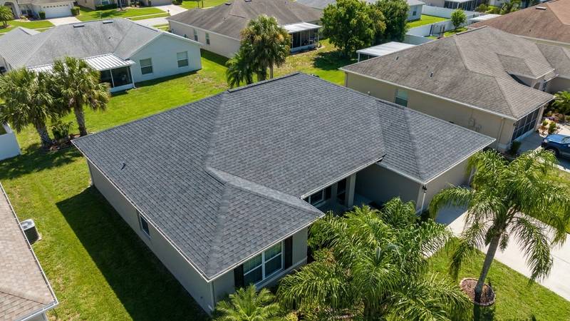 Example of roof cleaning in Holiday, FL — after soft washing. Asphalt shingle: heavy algae buildup is eliminated with a warranty-safe soft wash.