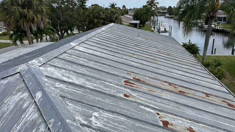 Example of roof cleaning in New Port Richey, FL — before soft washing. Concrete tile: algae is killed at the root with soft wash chemistry, not just rinsed.